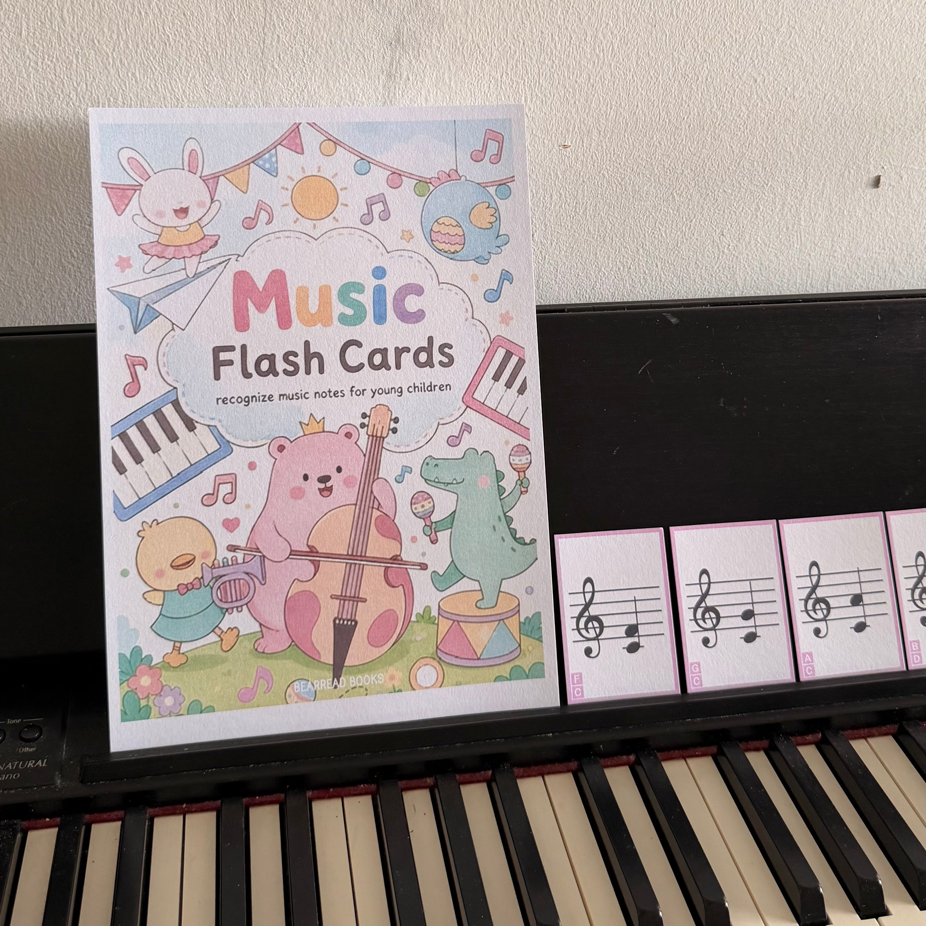 A set of colorful 'Music Flash Cards' features cute cartoon illustrations of animals playing musical instruments and several individual flash cards with musical notes.