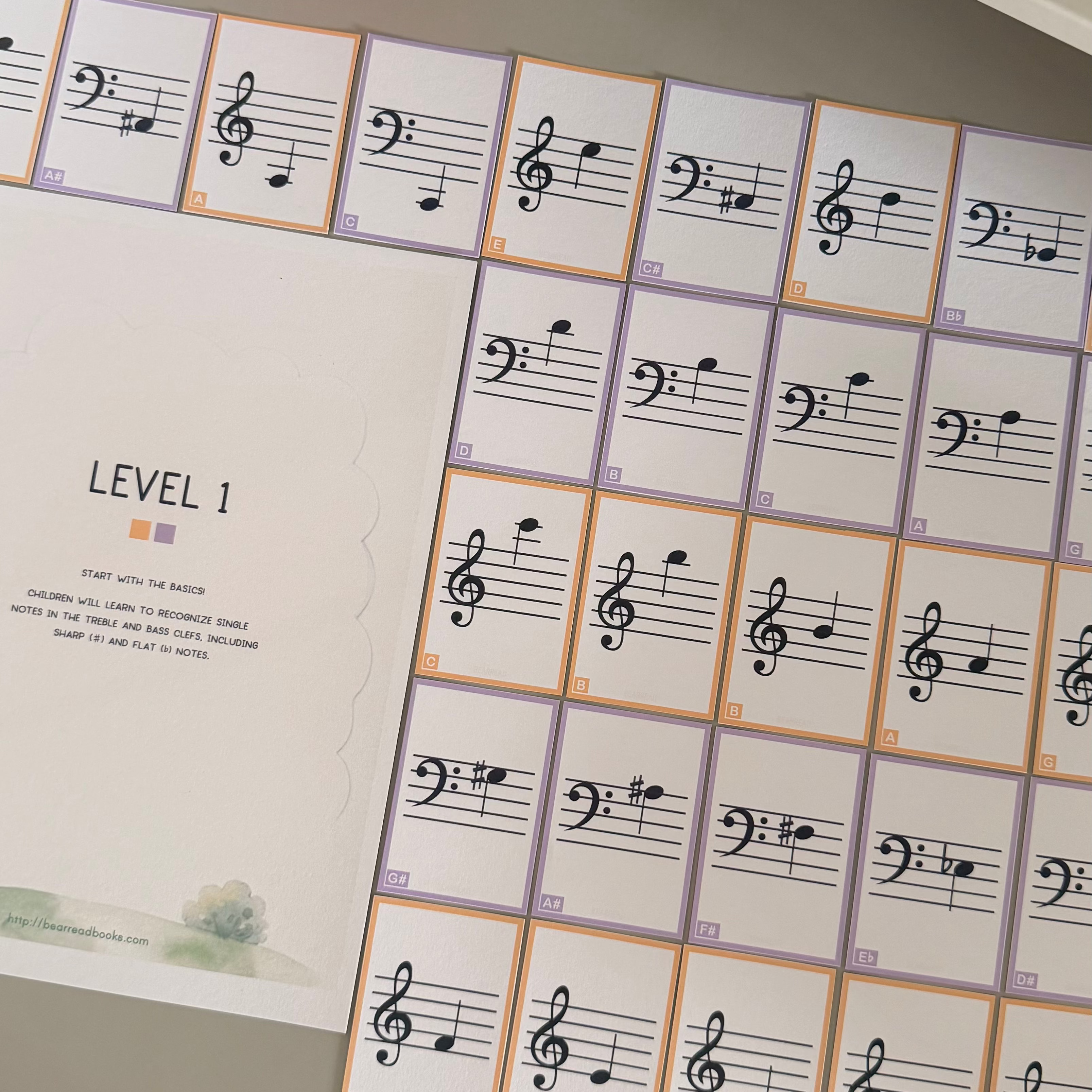 A music learning card, featuring printed sheet music staves and notes on individual cards.