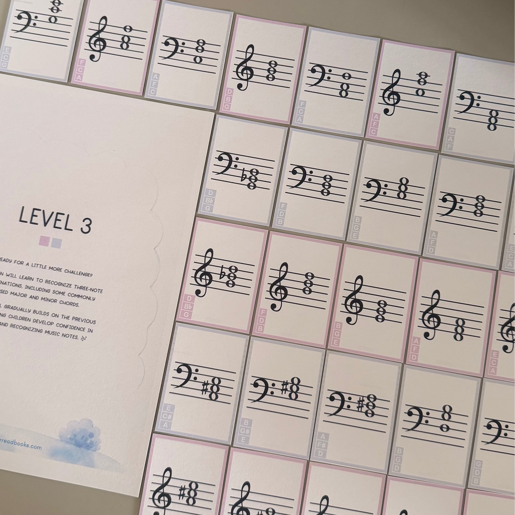 A music practice flash card set labeled 'LEVEL 3' with multiple small cards featuring bass clefs and sharps