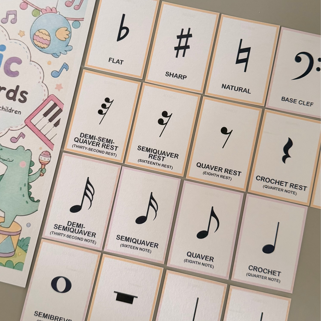 A music theory card deck shows musical note symbols and labels such as flat, sharp, natural, base clef, semitone, quarter rest, minim, and dotted minim.